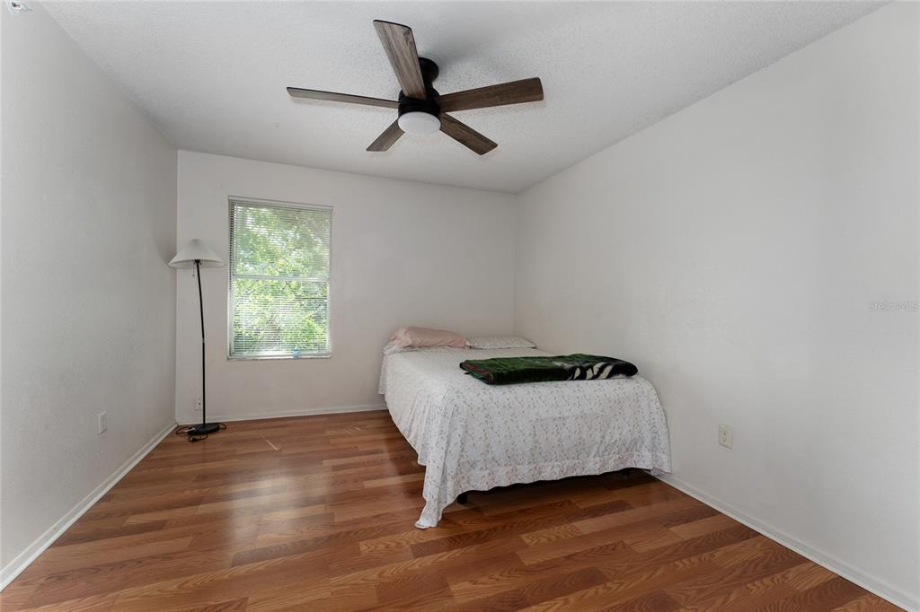 627 Dory Lane, Unit 304 Altamonte Springs, FL 32714 - Photo 20 of 28 a bedroom with a bed and a window