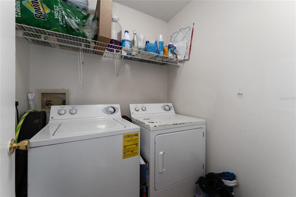 627 Dory Lane, Unit 304 Altamonte Springs, FL 32714 - Photo 25 of 28 a utility room with dryer and washer