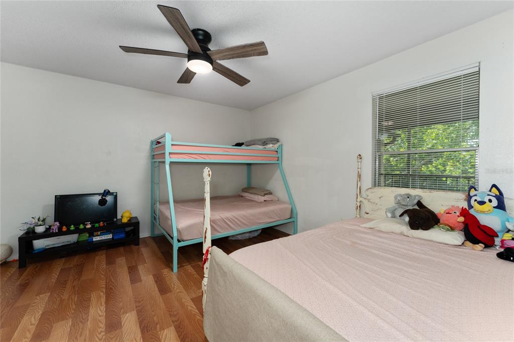627 Dory Lane, Unit 304 Altamonte Springs, FL 32714 - Photo 26 of 28 a bedroom with a bed and a tv