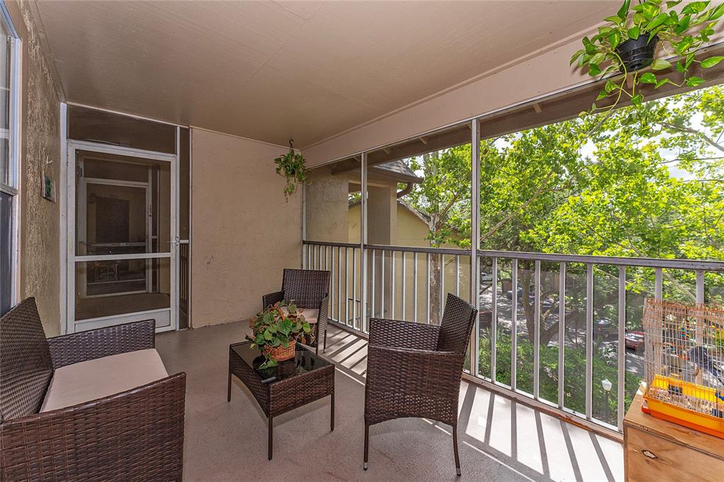 627 Dory Lane, Unit 304 Altamonte Springs, FL 32714 - Photo 10 of 28 a balcony with with an outdoor seating