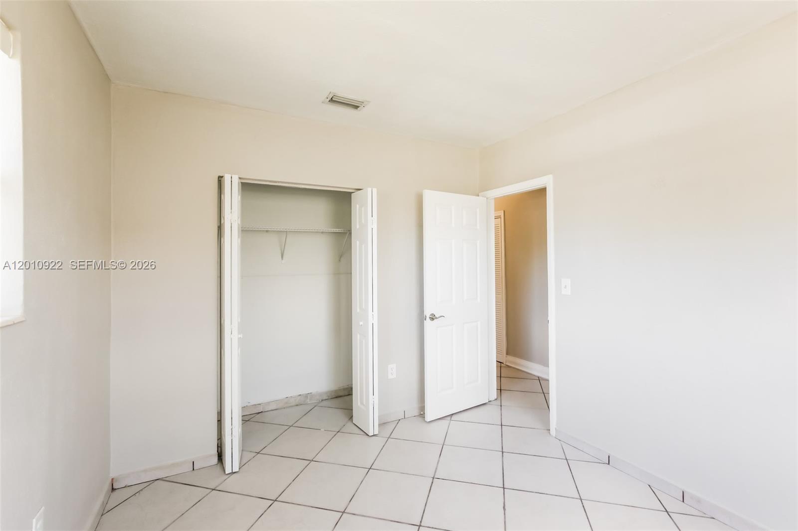 11460 Southwest 199th Street Miami, FL 33157 - Photo 13 of 18 a view of an empty room