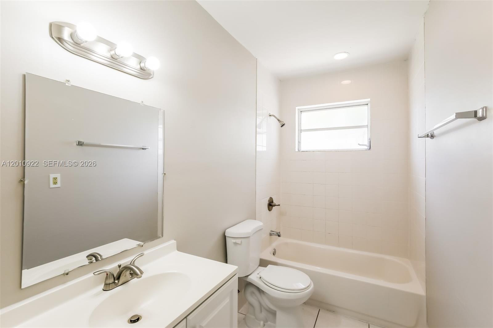 11460 Southwest 199th Street Miami, FL 33157 - Photo 17 of 18 a bathroom with a sink a toilet and shower