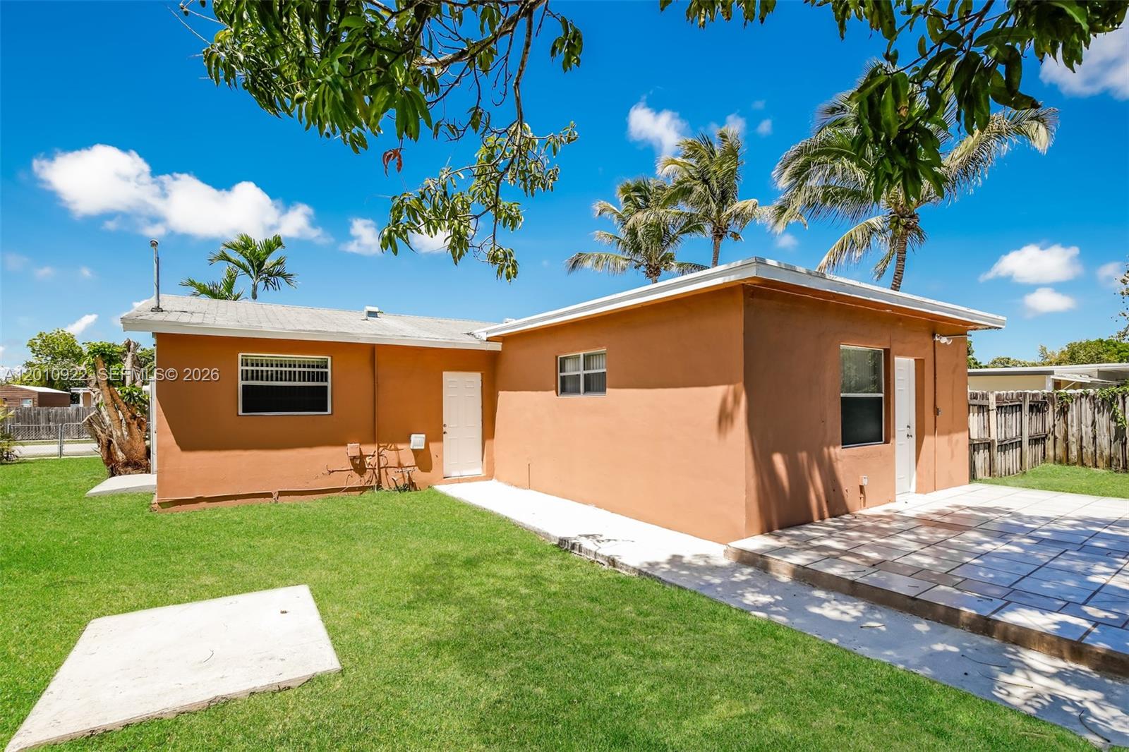 11460 Southwest 199th Street Miami, FL 33157 - Photo 18 of 18 a house with garden in front of it