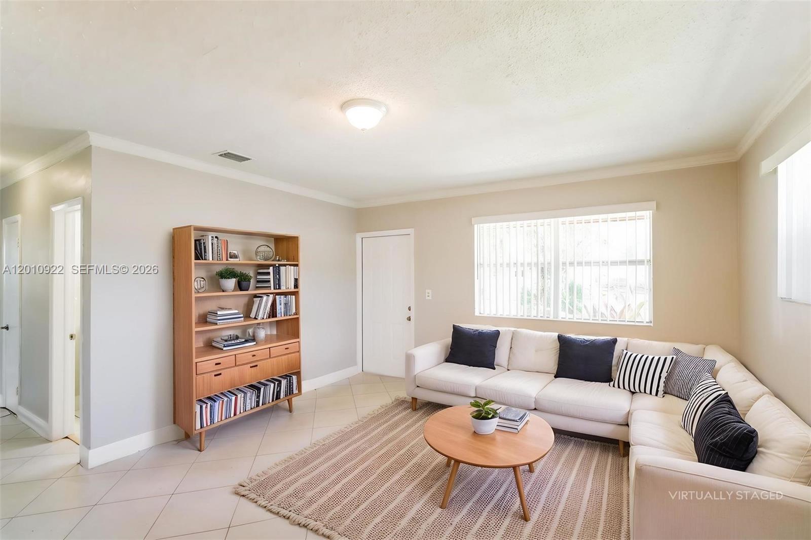 11460 Southwest 199th Street Miami, FL 33157 - Photo 4 of 18 a living room with furniture and a window