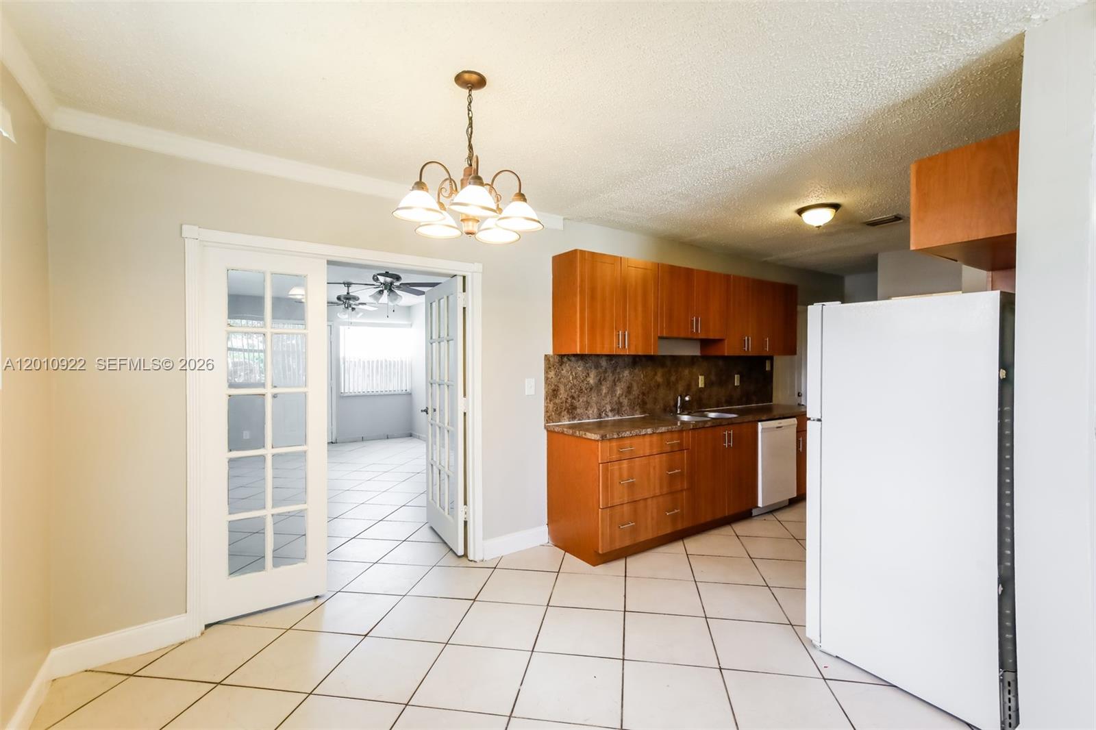 11460 Southwest 199th Street Miami, FL 33157 - Photo 5 of 18 a kitchen with stainless steel appliances a refrigerator and microwave