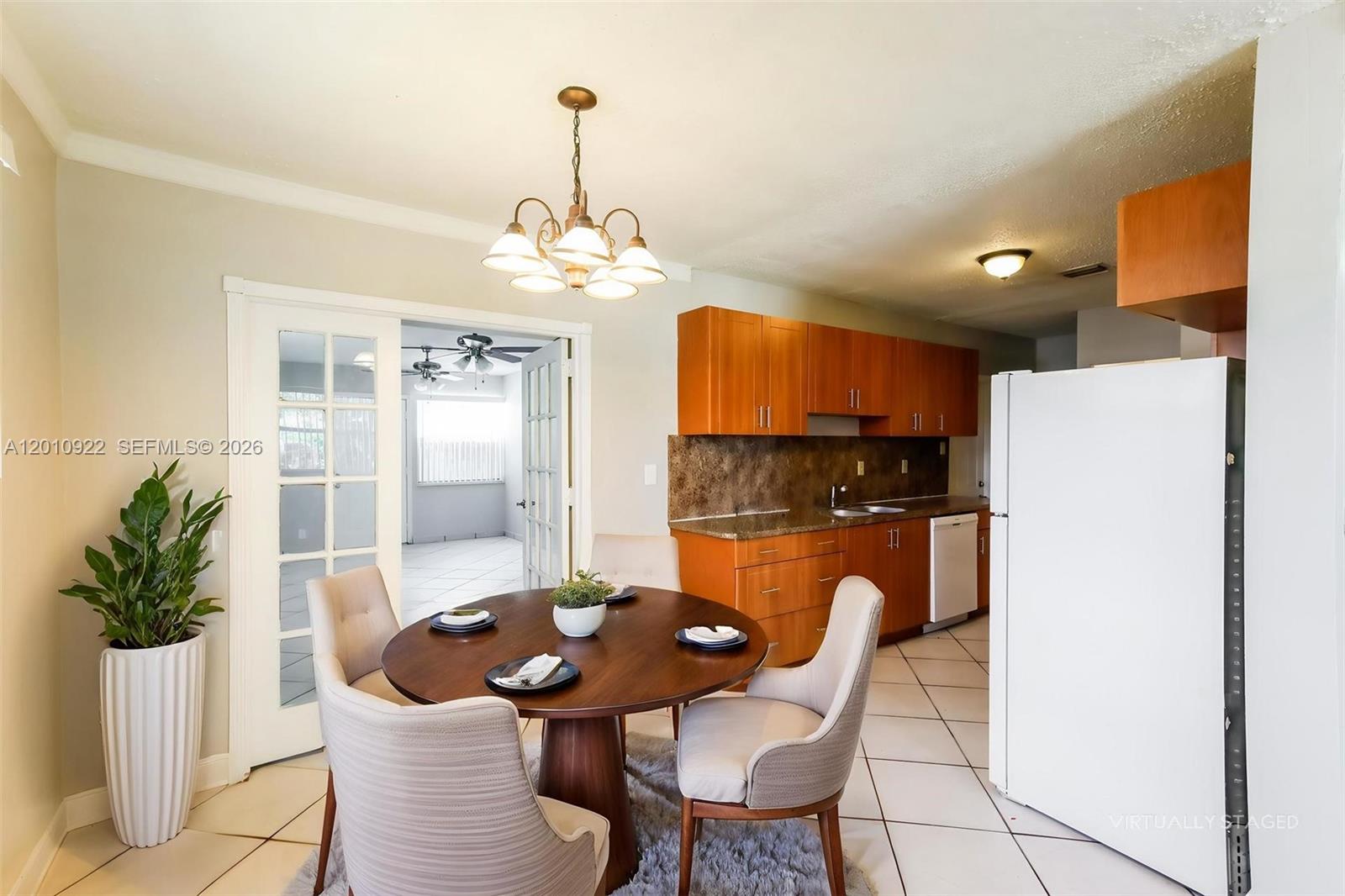 11460 Southwest 199th Street Miami, FL 33157 - Photo 6 of 18 a view of a dining room with furniture and wooden floor