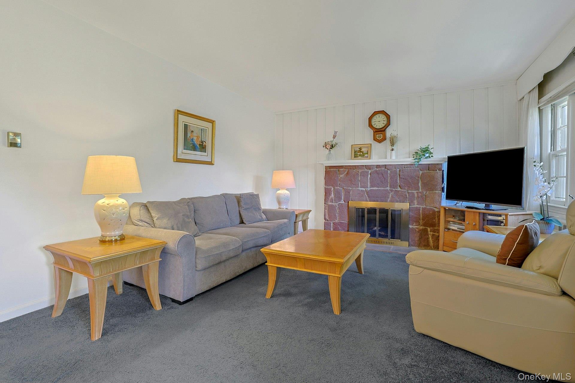 31 Townline Road Pearl River, NY 10965 - Photo 3 of 27 a living room with furniture and a flat screen tv