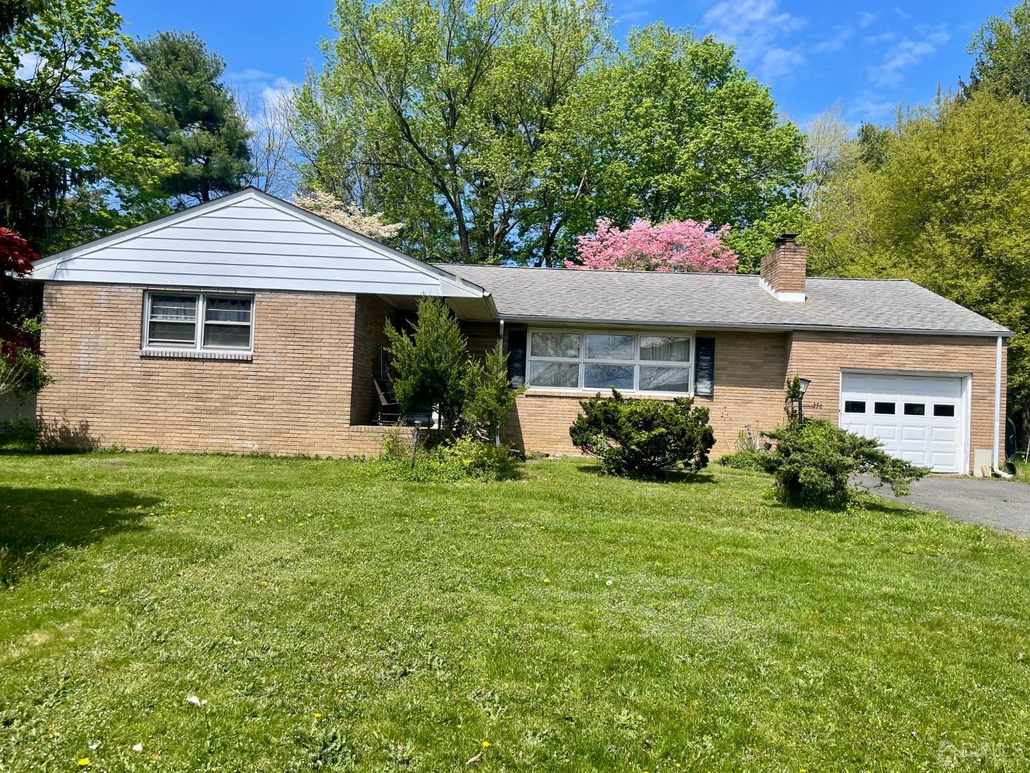 336 Dutch Neck Road East Windsor, NJ 08520 - Photo 1 of 16 a front view of a house with a yard