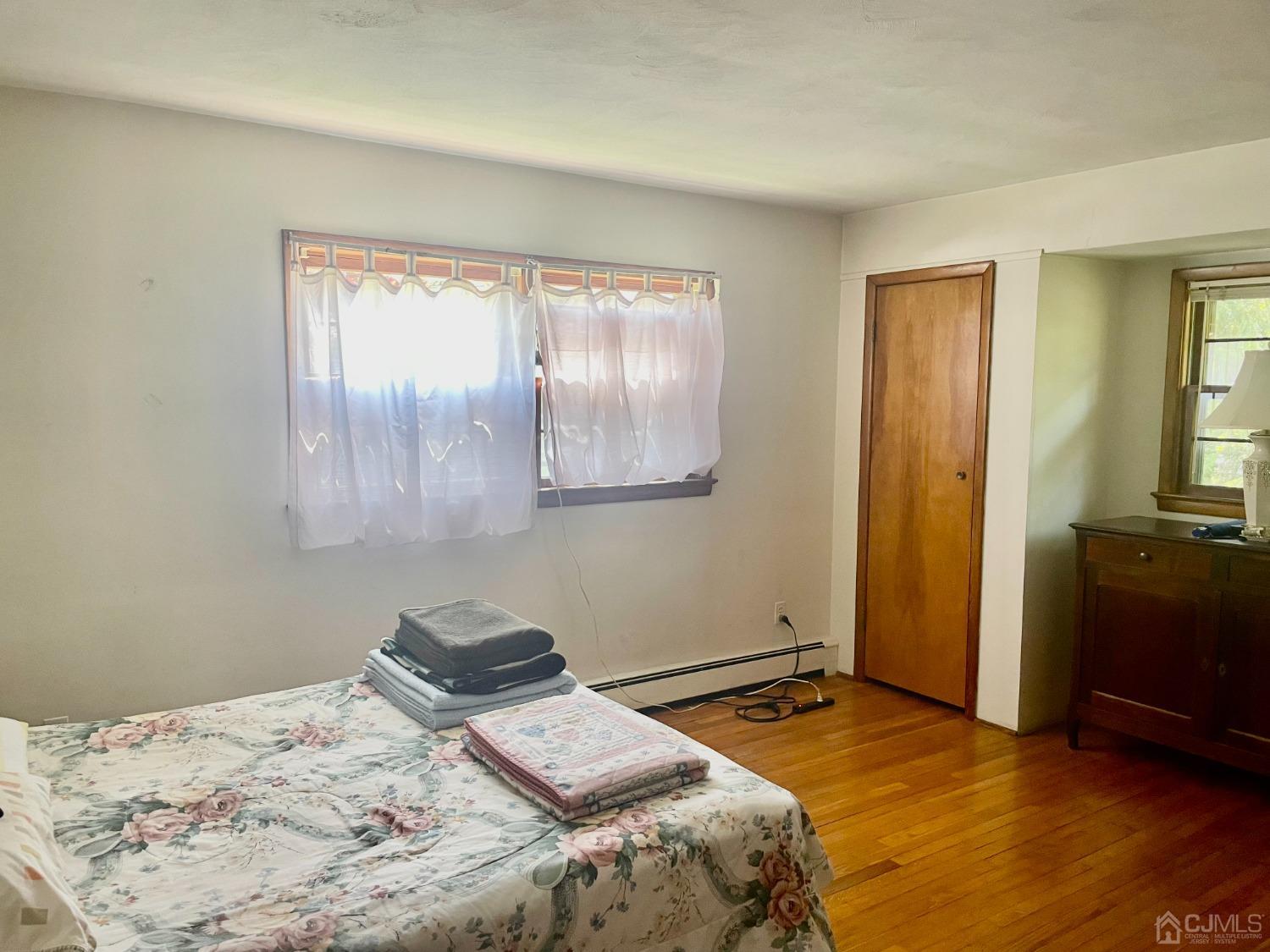 336 Dutch Neck Road East Windsor, NJ 08520 - Photo 6 of 16 a bedroom with a bed and a window