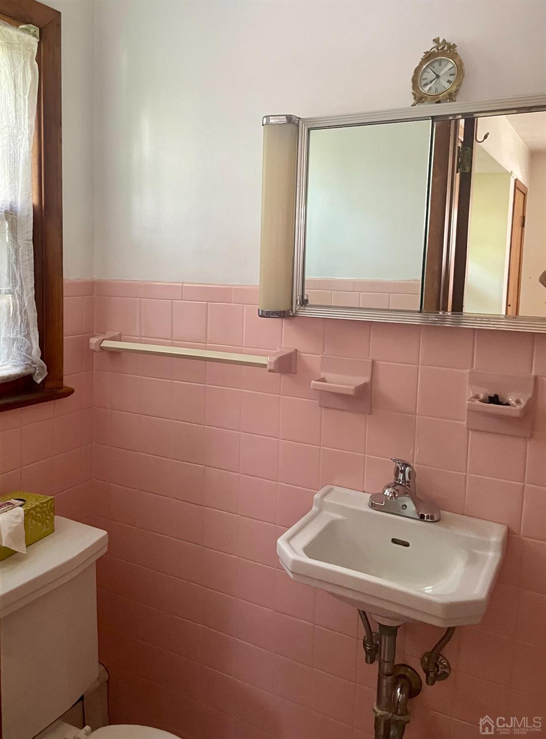 336 Dutch Neck Road East Windsor, NJ 08520 - Photo 7 of 16 a bathroom with a sink a mirror and a toilet