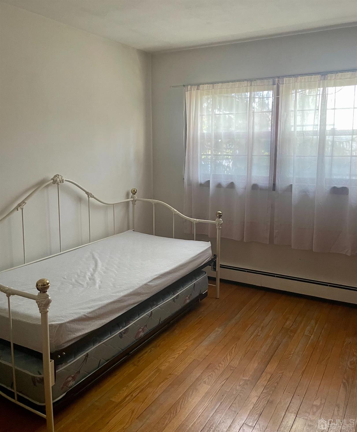 336 Dutch Neck Road East Windsor, NJ 08520 - Photo 8 of 16 a bedroom with a bed and large window