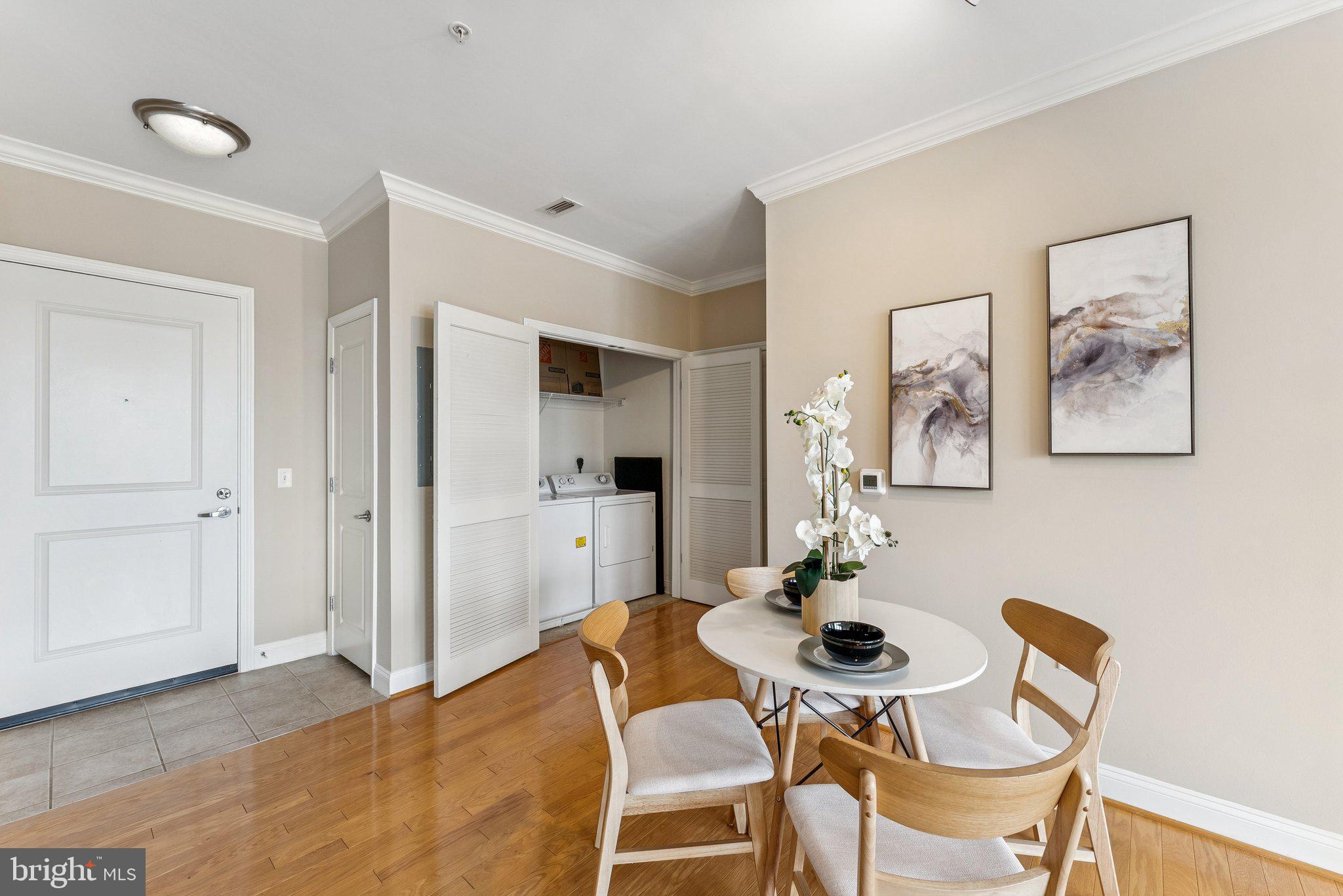 1391 Pennsylvania Ave. Southeast, Unit 403 Washington, DC 20003 - Photo 4 of 34 a view of a dining room with furniture and wooden floor