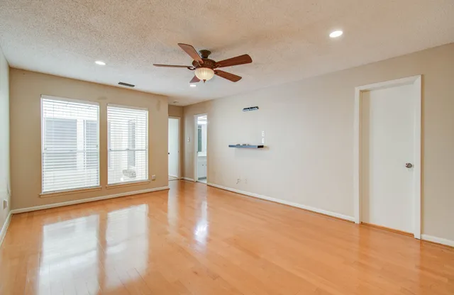 a view of an empty room with glass door