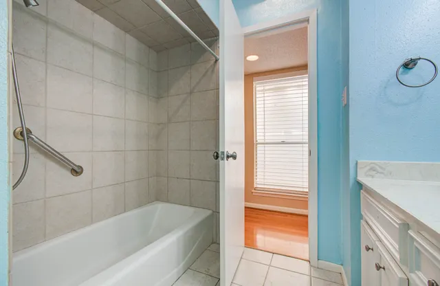 front view of a building with a garden