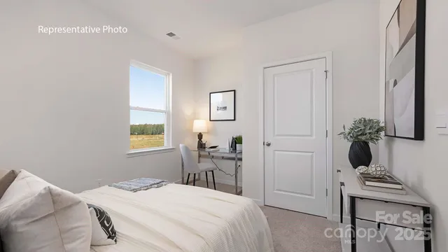 a bedroom with a bed and a table in it