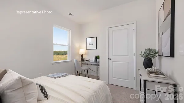 a bedroom with a bed and a table in it