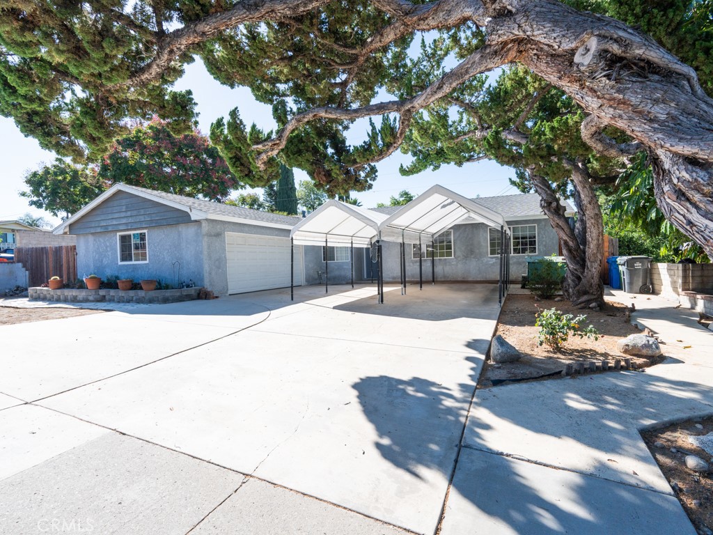 2790 Fitzgerald Road Simi Valley, CA 93065 - Photo 1 of 1 a front view of a house with a yard and garage