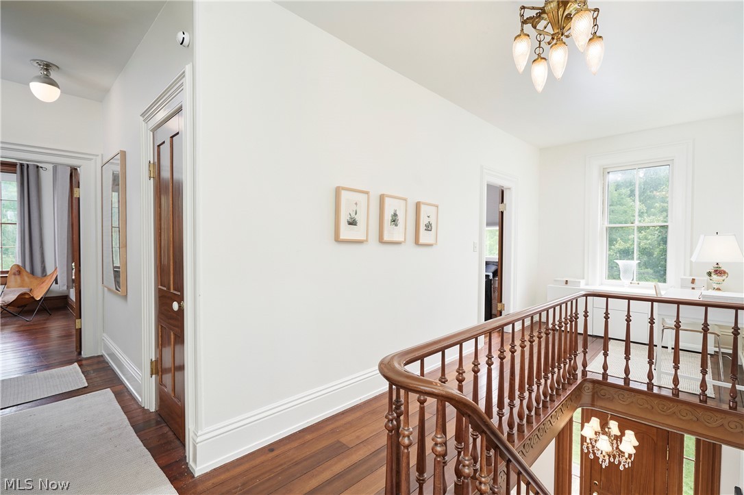 5046 Alger Road Richfield, OH 44286 - Photo 31 of 49 Hardwood flooring extending throughout the upper level, complemented by a traditional wood staircase with balusters