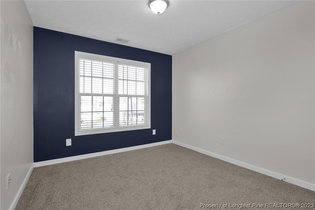 84 Loyalist Road Cameron, NC 28326 - Photo 17 of 40 an empty room with a window