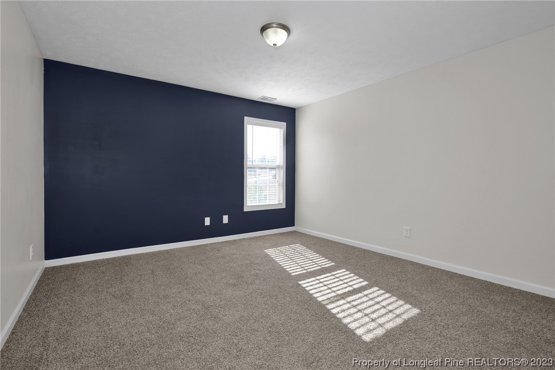 84 Loyalist Road Cameron, NC 28326 - Photo 23 of 40 a view of an empty room with a window