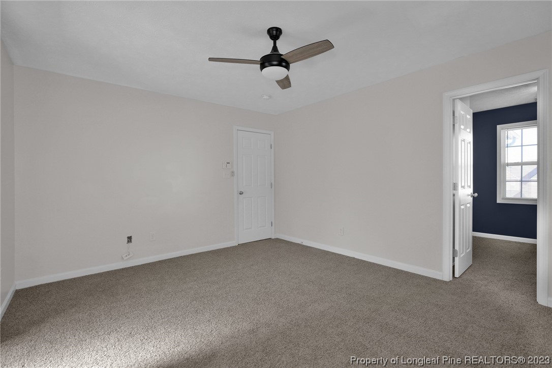 84 Loyalist Road Cameron, NC 28326 - Photo 26 of 40 a view of empty room with ceiling fan
