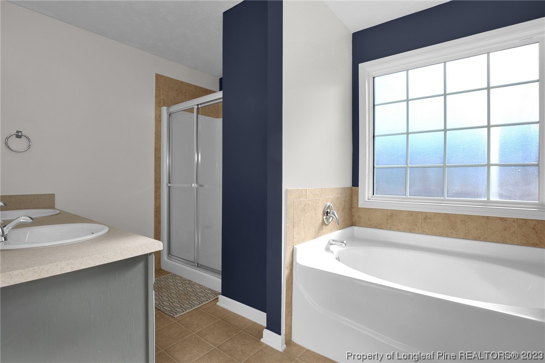 84 Loyalist Road Cameron, NC 28326 - Photo 28 of 40 a bathroom with a bathtub and a sink
