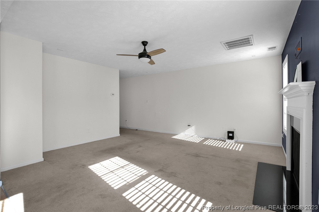 84 Loyalist Road Cameron, NC 28326 - Photo 7 of 40 a view of empty room with windows