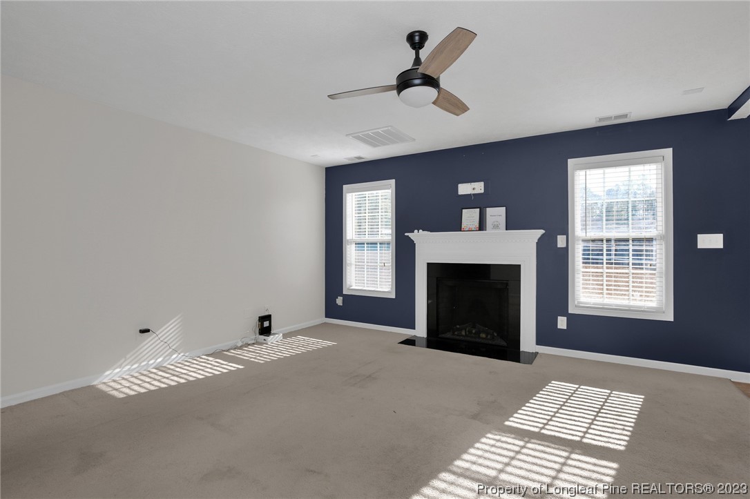 84 Loyalist Road Cameron, NC 28326 - Photo 9 of 40 a view of a livingroom with a fireplace and window