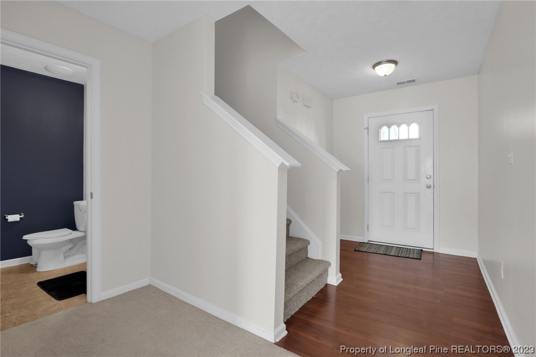 84 Loyalist Road Cameron, NC 28326 - Photo 10 of 40 a view of entryway and hall with wooden floor