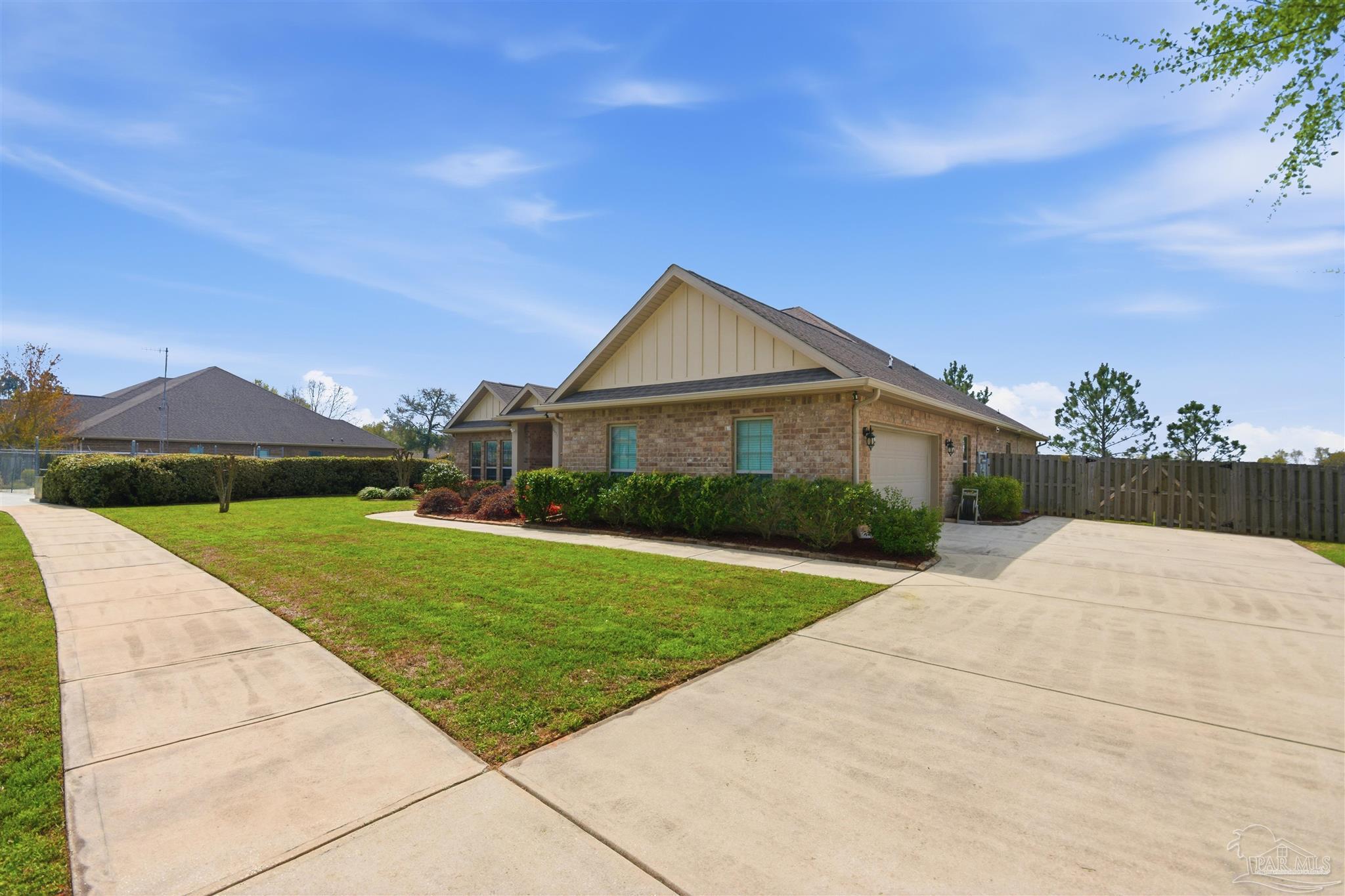2677 Tulip Hill Road Pace, FL 32571 - Photo 2 of 35 a front view of a house with yard