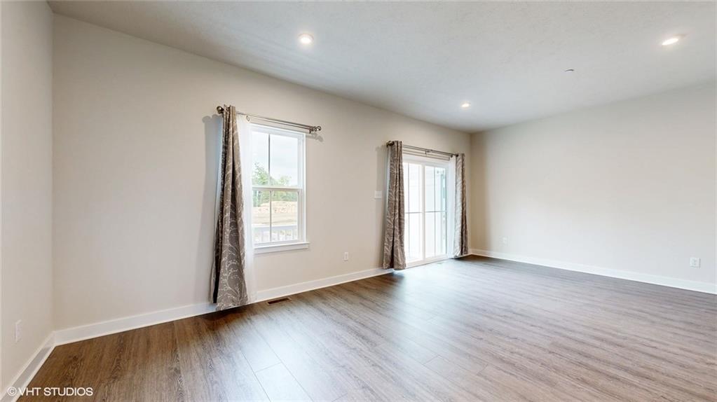 4908 Spruce Road Gibsonia, PA 15044 - Photo 11 of 39 a view of an empty room with wooden floor and window