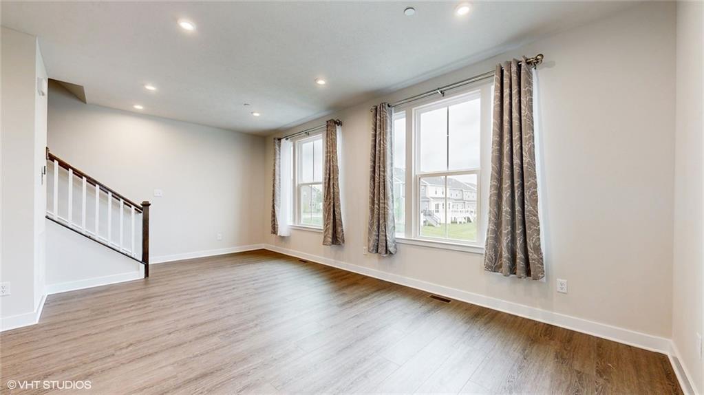 4908 Spruce Road Gibsonia, PA 15044 - Photo 16 of 39 a view of an empty room with wooden floor and a window