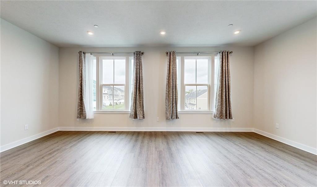 4908 Spruce Road Gibsonia, PA 15044 - Photo 17 of 39 an empty room with wooden floor and windows