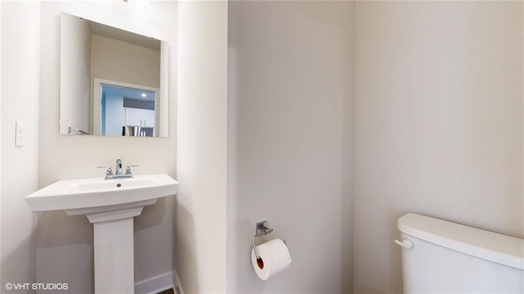 4908 Spruce Road Gibsonia, PA 15044 - Photo 18 of 39 a bathroom with a sink a toilet and mirror
