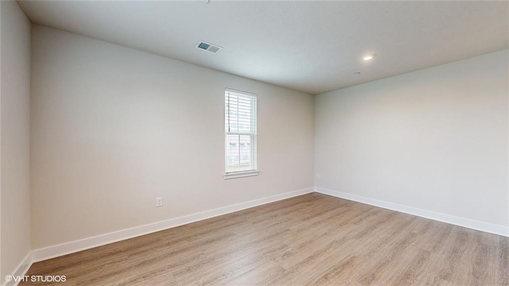 4908 Spruce Road Gibsonia, PA 15044 - Photo 5 of 39 an empty room with wooden floor and windows