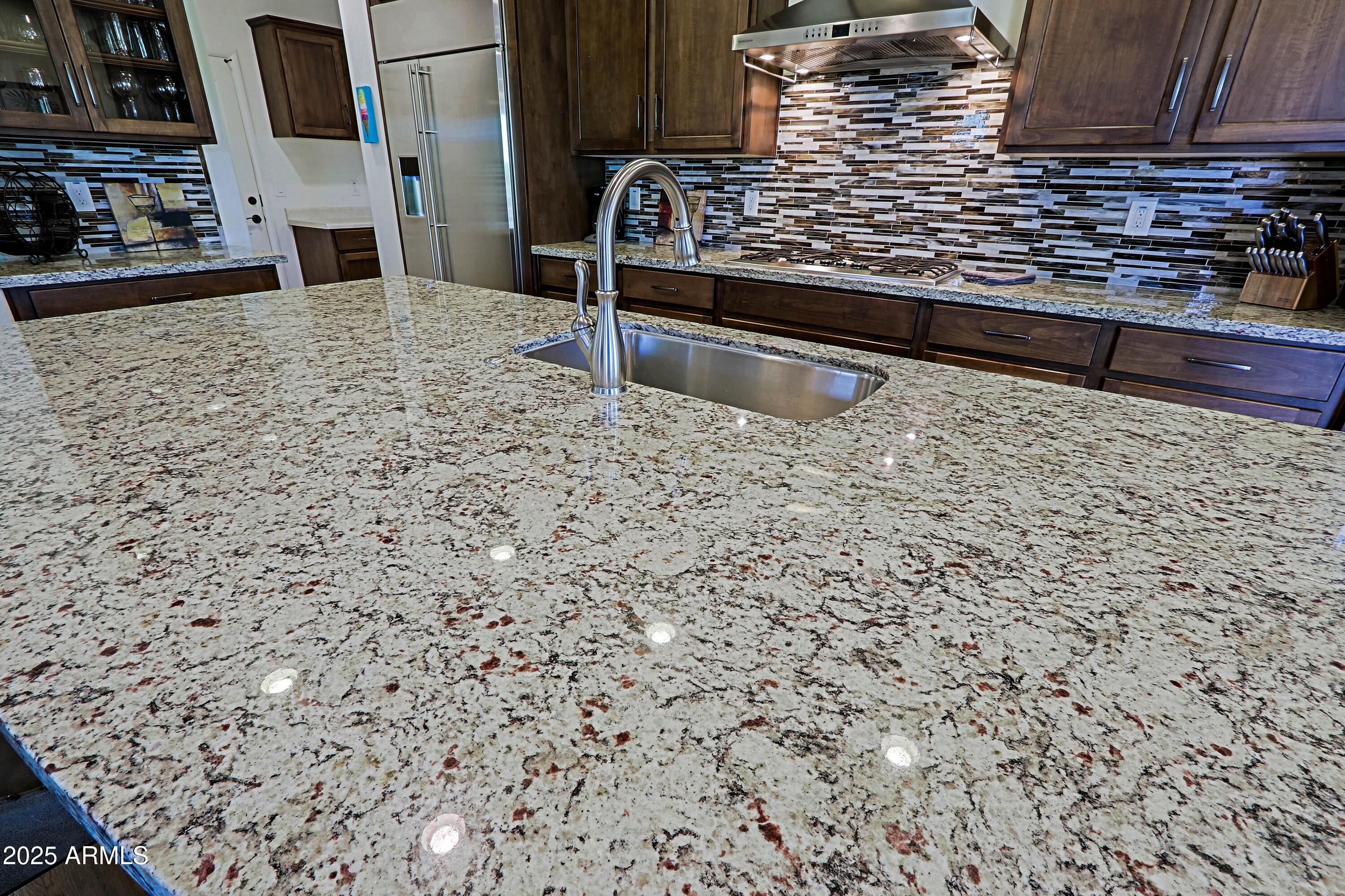18004 East Silver Sage Lane Rio Verde, AZ 85263 - Photo 10 of 92 a view of a terrace with wooden floor and a fireplace