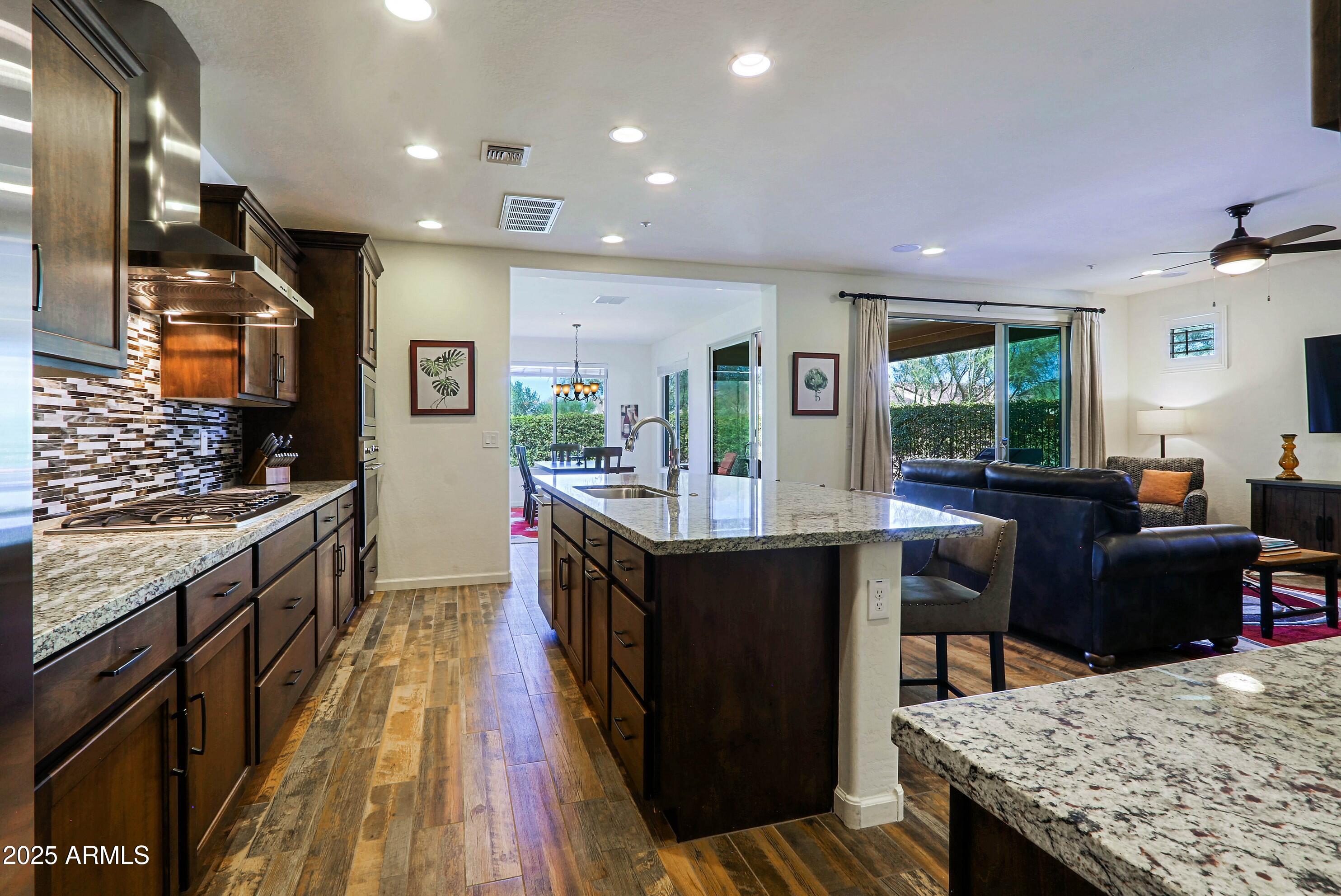 18004 East Silver Sage Lane Rio Verde, AZ 85263 - Photo 12 of 92 a kitchen with granite countertop lots of counter top space and stainless steel appliances