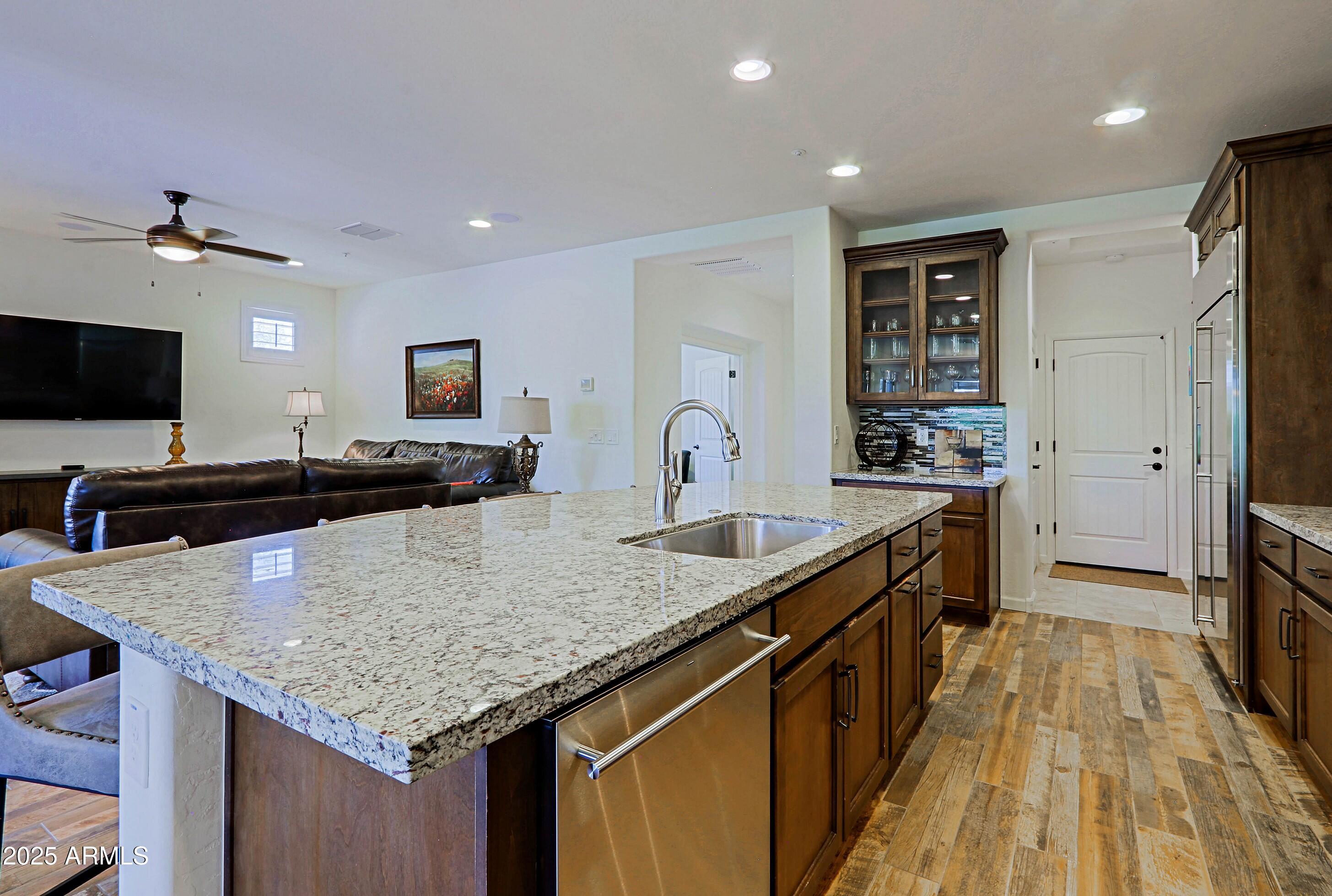 18004 East Silver Sage Lane Rio Verde, AZ 85263 - Photo 14 of 92 a kitchen with stainless steel appliances granite countertop a sink stove and refrigerator