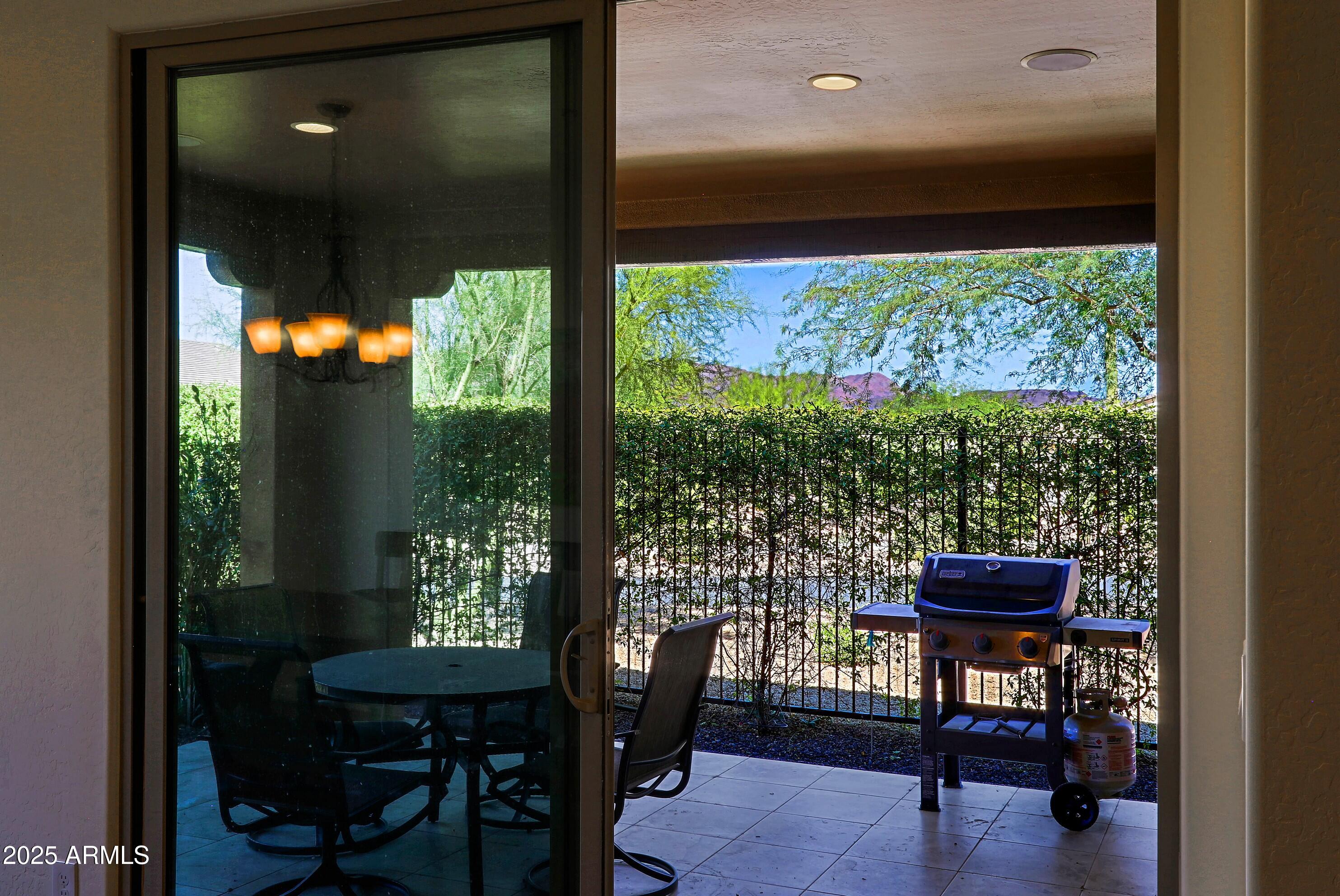 18004 East Silver Sage Lane Rio Verde, AZ 85263 - Photo 21 of 92 a view of a dining room with furniture window and outside view
