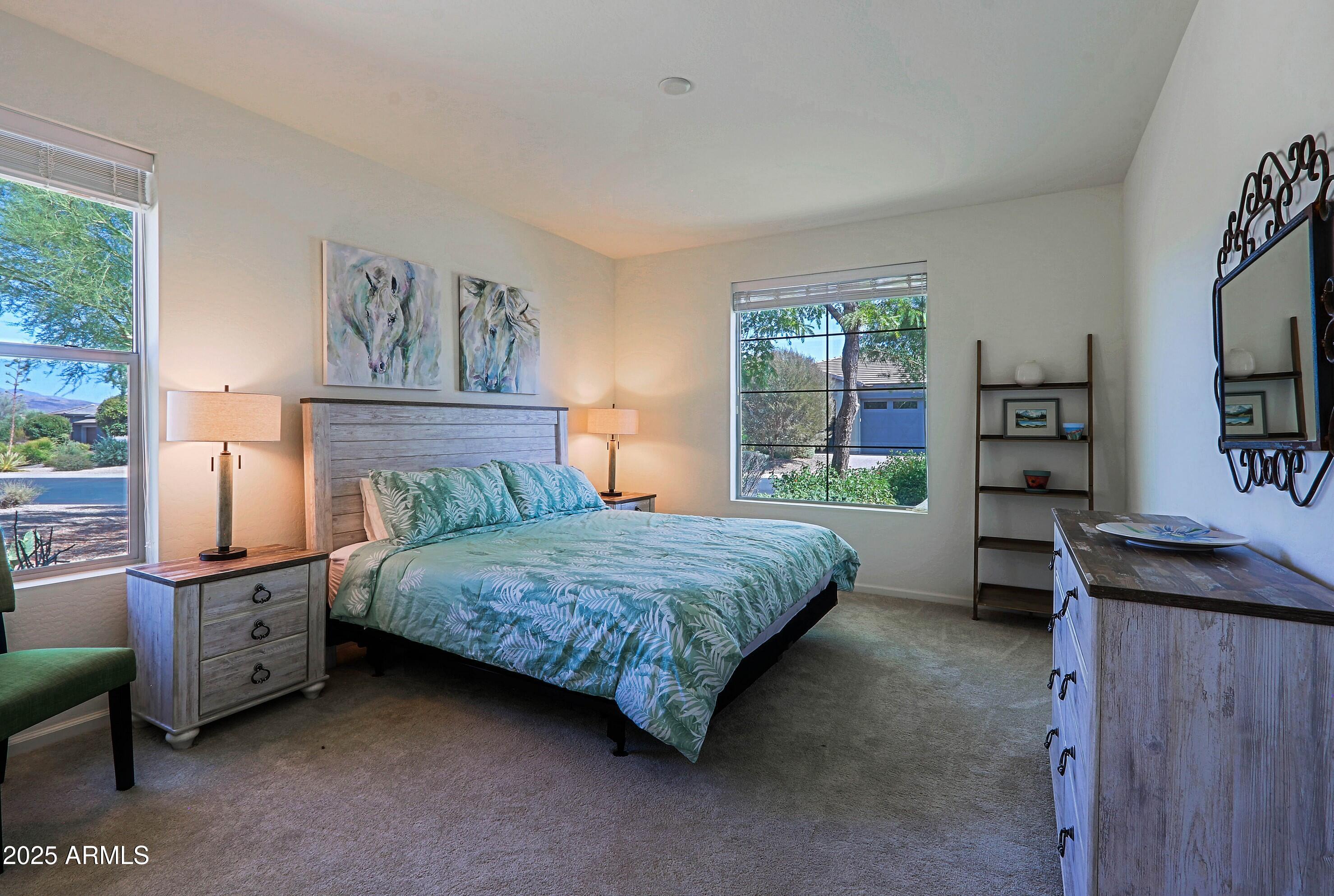 18004 East Silver Sage Lane Rio Verde, AZ 85263 - Photo 35 of 92 a bedroom with a bed dresser and a window