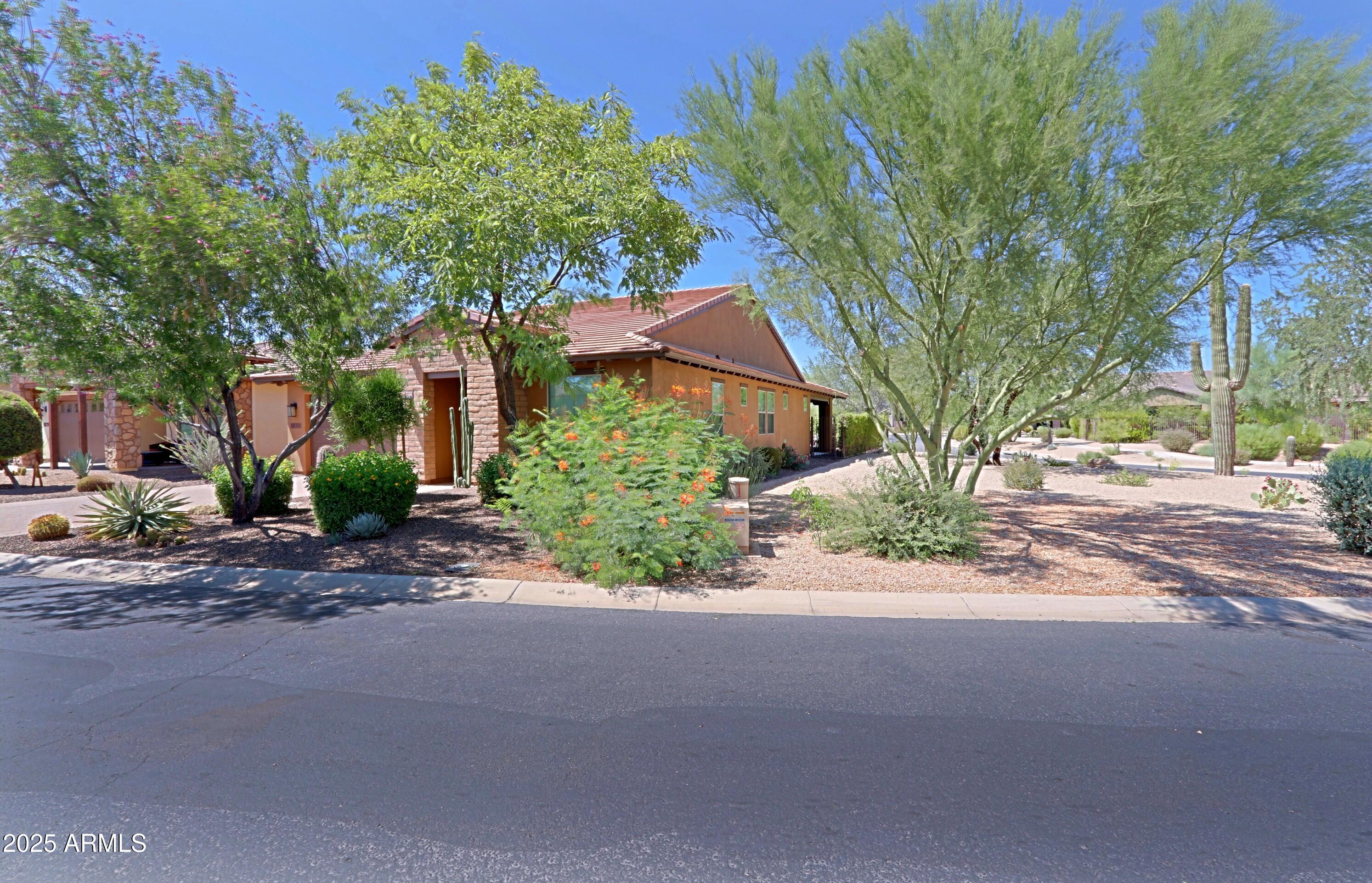 18004 East Silver Sage Lane Rio Verde, AZ 85263 - Photo 5 of 92 a view of a street with a house