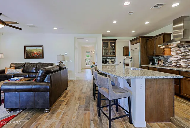 a kitchen with granite countertop lots of counter top space and stainless steel appliances