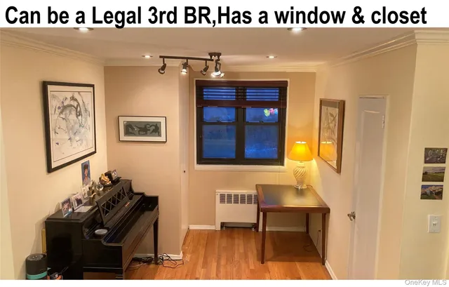 a bathroom with a sink a mirror and a painting on the wall