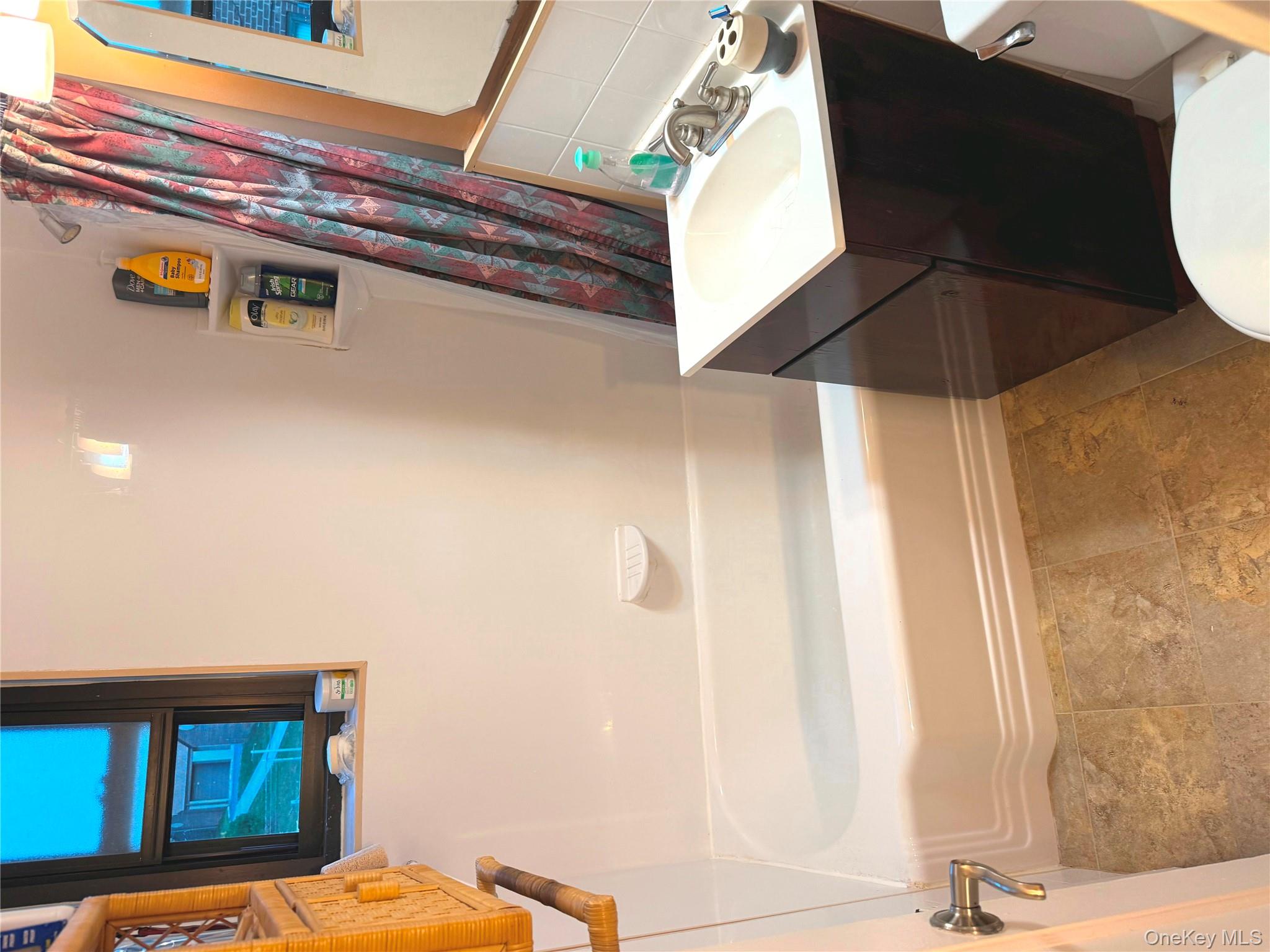 245-48 62nd Avenue, Unit UPPER 2/3BR Queens, NY 11362 - Photo 18 of 29 a bathroom with a sink and a mirror