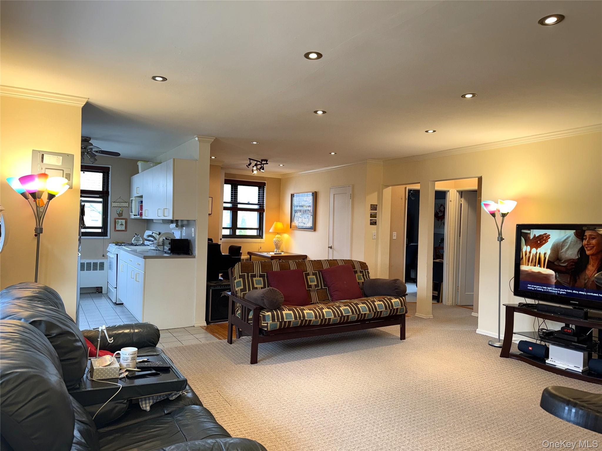 245-48 62nd Avenue, Unit UPPER 2/3BR Queens, NY 11362 - Photo 21 of 29 a living room with furniture gym equipment and a flat screen tv