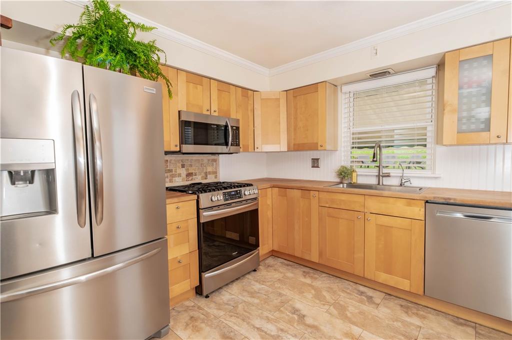 165 North Ben Franklin Road Indiana, PA 15701 - Photo 8 of 27 a kitchen with stainless steel appliances a refrigerator sink and microwave