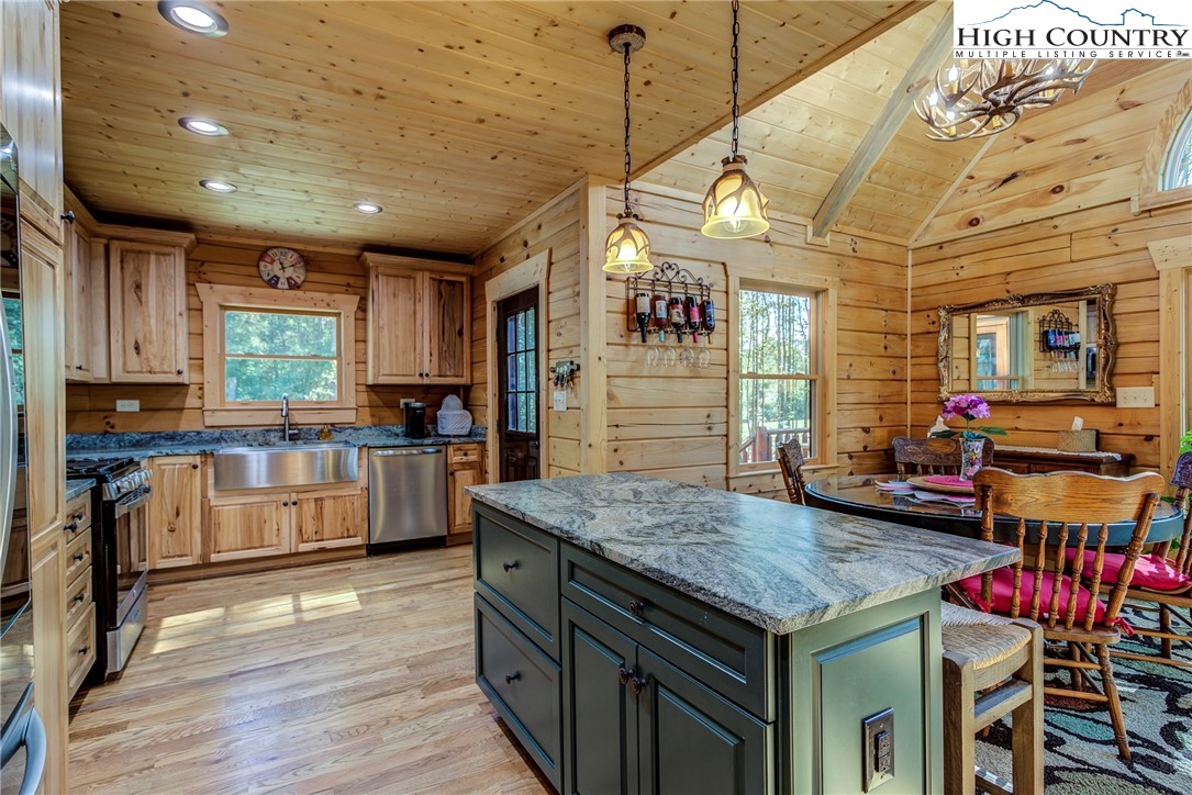 3460 South Center Church Road Thurmond, NC 28683 - Photo 23 of 50 a kitchen with sink cabinets and wooden floor
