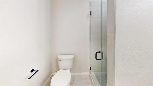 a bathroom with a toilet and a vanity
