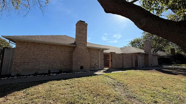 a view of a backyard of the house