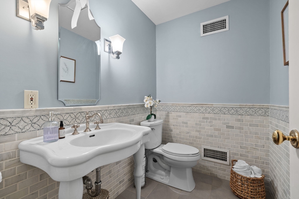 52 Pineswamp Road Ipswich, MA 01938 - Photo 11 of 41 a bathroom with a sink toilet and mirror